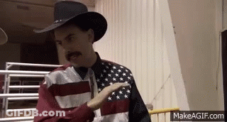 Man In Cowboy Hat And Flag Shirt Pointing GIF