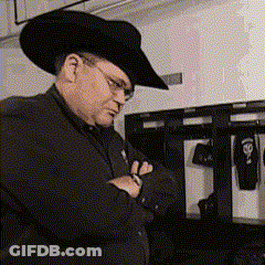 Man In Cowboy Hat And Glasses Looking Down GIF