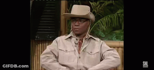 Man In Cowboy Hat And Glasses Sitting On Chair GIF