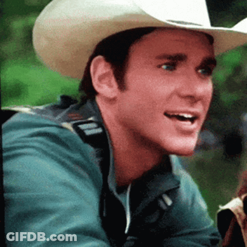 Man In Cowboy Hat And Green Jacket Smiling GIF