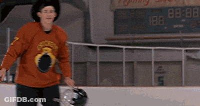 Man In Cowboy Hat And Hockey Jersey In Front Of Sign GIF