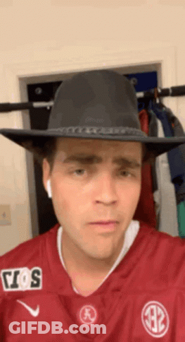 Man In Cowboy Hat And Maroon Jersey GIF