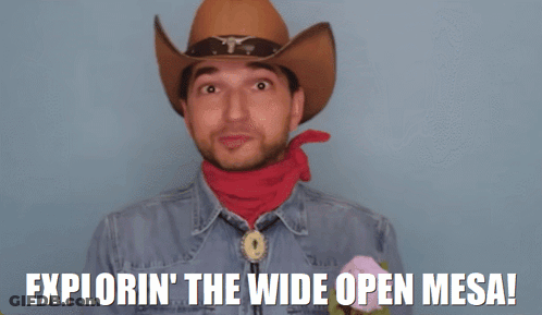 Man In Cowboy Hat And Red Bandana Saying Exploring The Wide Open Mesa GIF