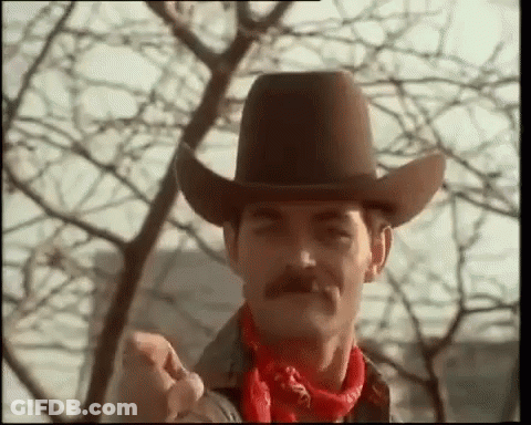 Man In Cowboy Hat And Red Bandana Thumbs Up GIF