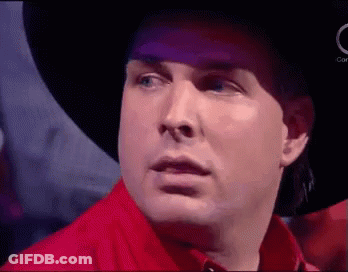 Man In Cowboy Hat And Red Shirt Making Funny Face GIF
