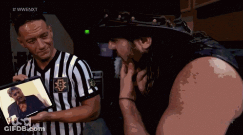 Man In Cowboy Hat And Referee Holding Self Pictures GIF