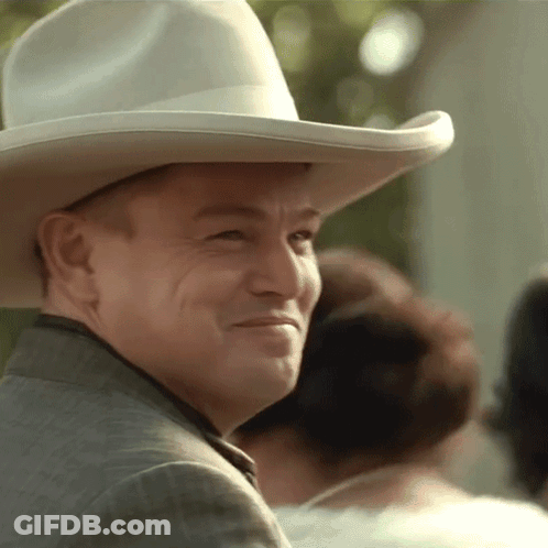 Man In Cowboy Hat And Suit Smiling GIF