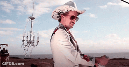 Man In Cowboy Hat And Sunglasses In Front Of Chandelier GIF
