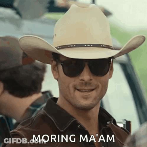 Man In Cowboy Hat And Sunglasses Saying Morning Ma'am GIF