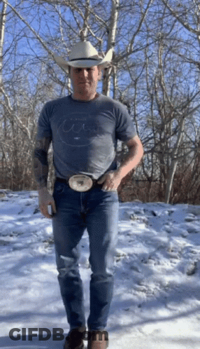 Man In Cowboy Hat And T-Shirt In Snow GIF