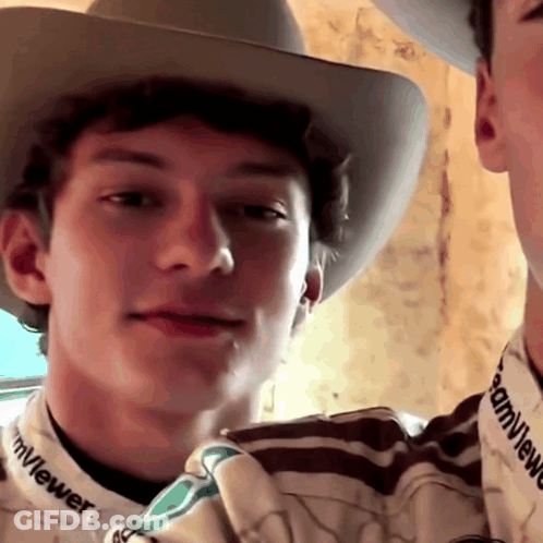 Man In Cowboy Hat And TeamViewer Shirt GIF
