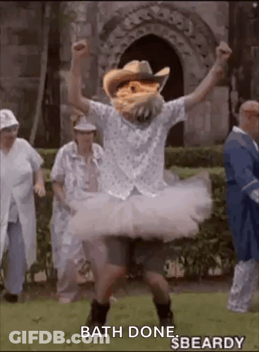 Man In Cowboy Hat And Tutu Dancing In Grass GIF
