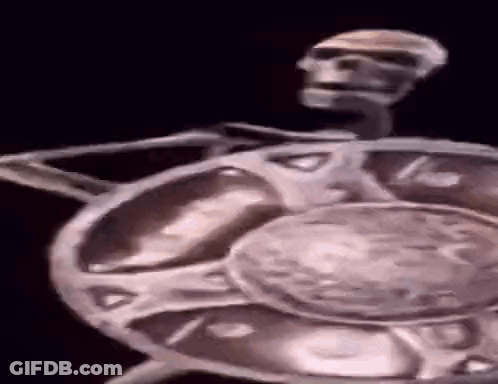 Man In Cowboy Hat And Vest Holding Gun GIF