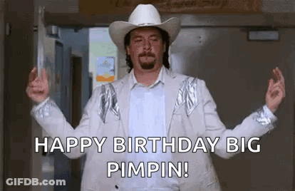Man In Cowboy Hat And White Jacket In Doorway GIF