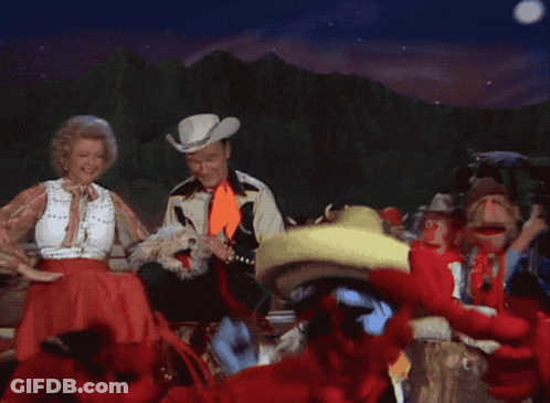 Man In Cowboy Hat And Woman In Sombrero Dancing GIF