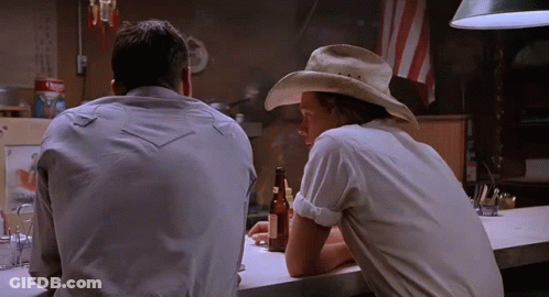 Man In Cowboy Hat At Bar With Beer GIF