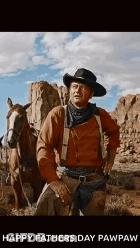 Man In Cowboy Hat Beside Horse In Desert GIF