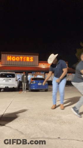 Man In Cowboy Hat Dancing At Hooters GIF