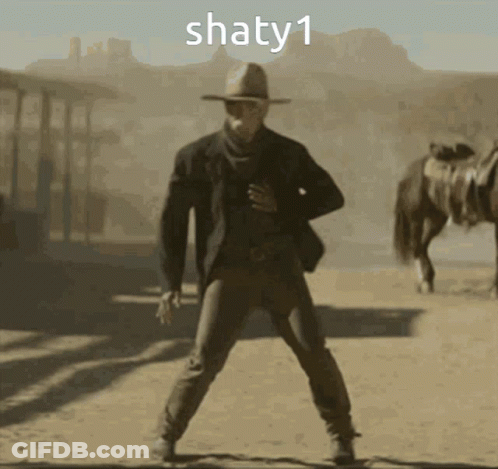 Man In Cowboy Hat Dancing In Desert With Horse And Text Shaty1 GIF