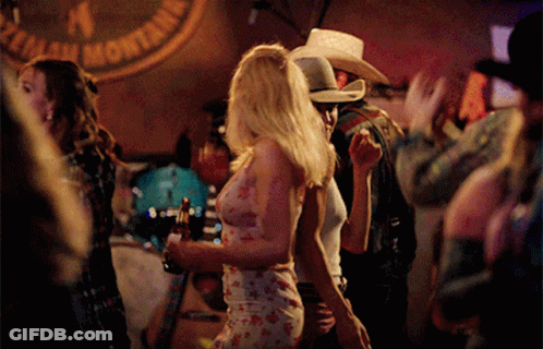 Man In Cowboy Hat Dancing In Front Of Montana Sign GIF