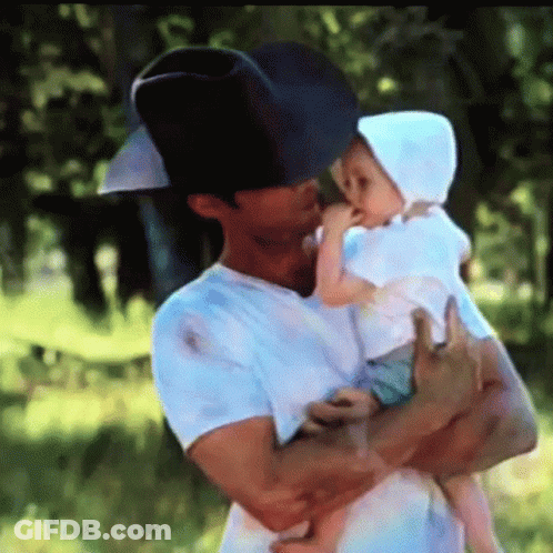 Man In Cowboy Hat Holding Baby GIF