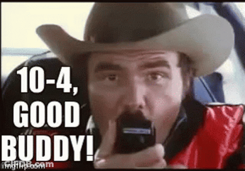 Man In Cowboy Hat Holding Cell Phone Saying 10-4-1 Good Buddy GIF