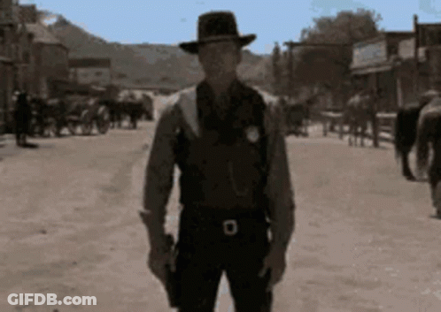 Man In Cowboy Hat Holding Gun GIF