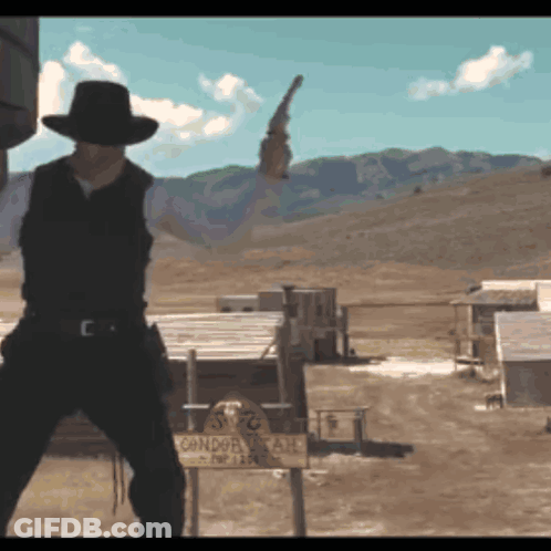Man In Cowboy Hat Holding Gun At Condor Ranch GIF