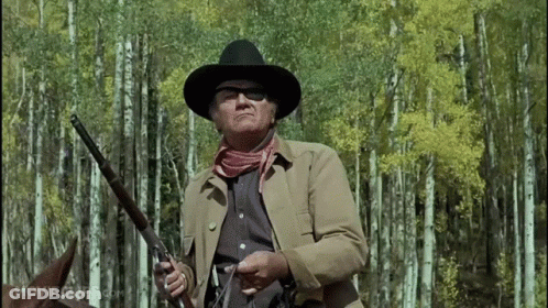 Man In Cowboy Hat Holding Gun Forest Movieclips.com GIF