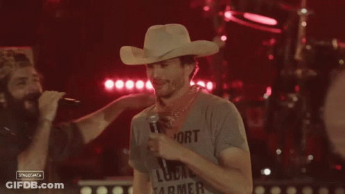 Man In Cowboy Hat Holding Microphone GIF