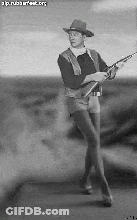 Man In Cowboy Hat Holding Rifle GIF