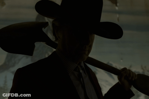 Man In Cowboy Hat Holding Shovel Over Shoulder GIF