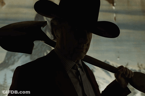 Man In Cowboy Hat Holding Shovel Over Shoulder GIF