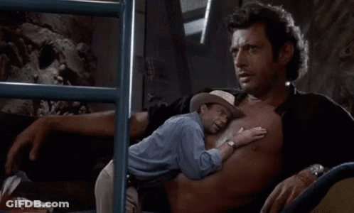 Man In Cowboy Hat Hugging Man In Blue Shirt GIF