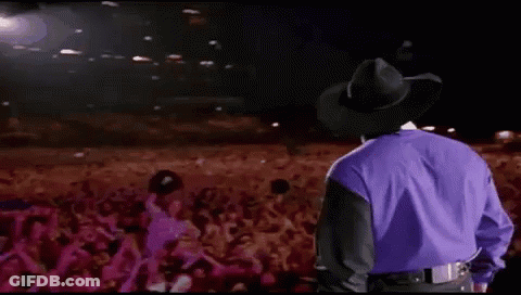 Man In Cowboy Hat In Front Of Crowd GIF