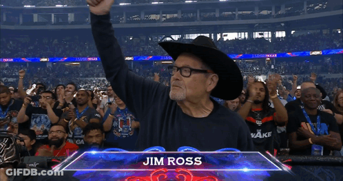 Man In Cowboy Hat In Front Of Jim Ross Sign GIF