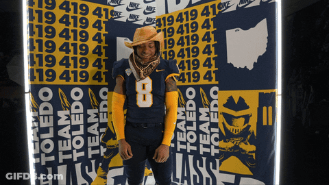 Man In Cowboy Hat In Front Of Nike Wall GIF