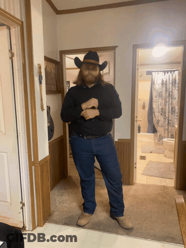 Man In Cowboy Hat In Hallway GIF