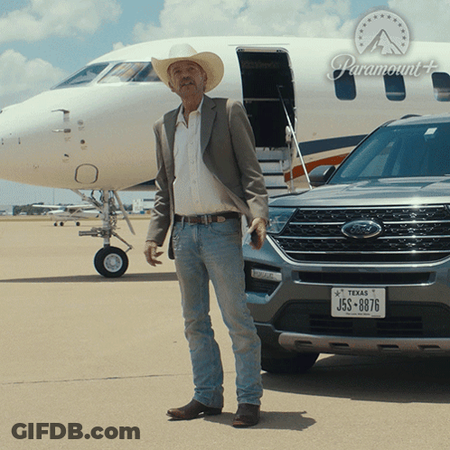 Man In Cowboy Hat Next To Ford Vehicle GIF