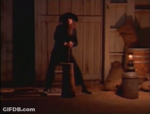 Man In Cowboy Hat Next To Woman GIF
