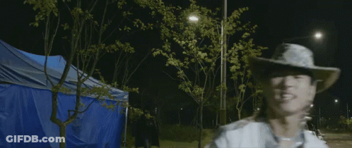 Man In Cowboy Hat On Roadside GIF
