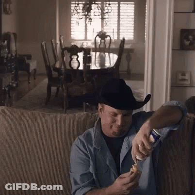 Man In Cowboy Hat Opening Beer GIF