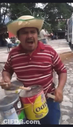 Man In Cowboy Hat Playing Drum With Oatmeal Can GIF