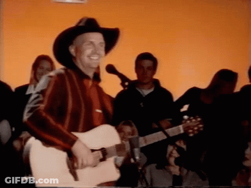 Man In Cowboy Hat Playing Guitar GIF