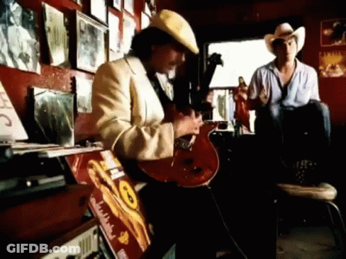 Man In Cowboy Hat Playing Guitar GIF