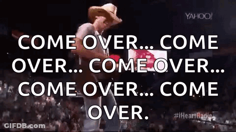 Man In Cowboy Hat Playing Guitar On Stage GIF