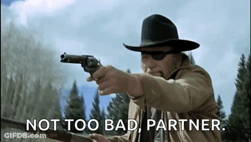 Man In Cowboy Hat Pointing Gun Saying Not Too Bad Partner GIF