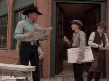 Man In Cowboy Hat Reading Paper GIF