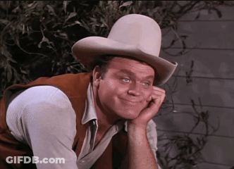 Man In Cowboy Hat Resting Hand On Chin GIF