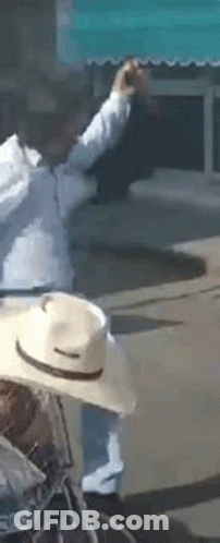 Man In Cowboy Hat Riding Bicycle GIF
